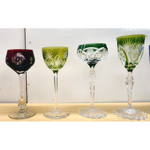 243 - A set of ten crystal hock glasses, each with a different style and coloured bowl, stem and base