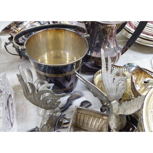 282 - Silver plated tableware: to include an ice bucket; and a bottle coaster 