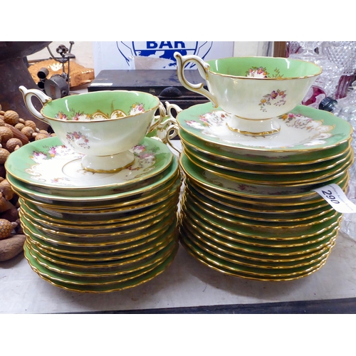 290 - Coalport china teaware, decorated in green and gilt