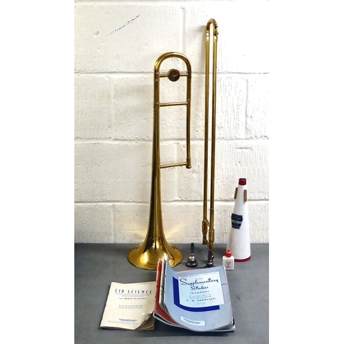 295 - An EMO Champion brass trombone  boxed