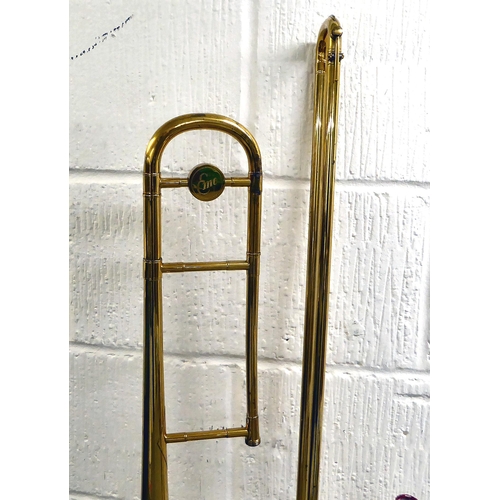 295 - An EMO Champion brass trombone  boxed