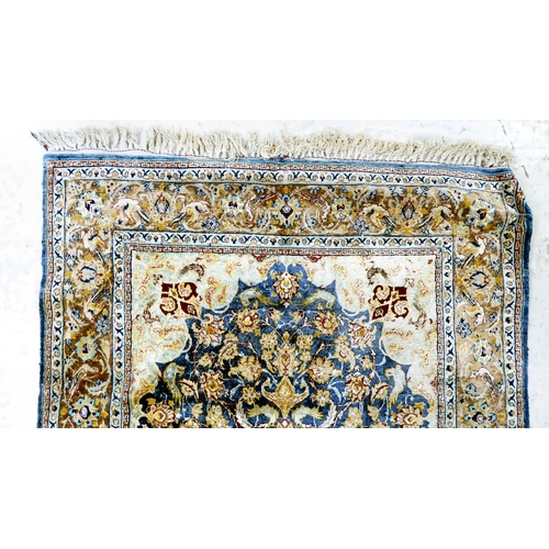 298 - A Persian part-woven silk rug, decorated with birds and flora, on a multi-coloured ground  42