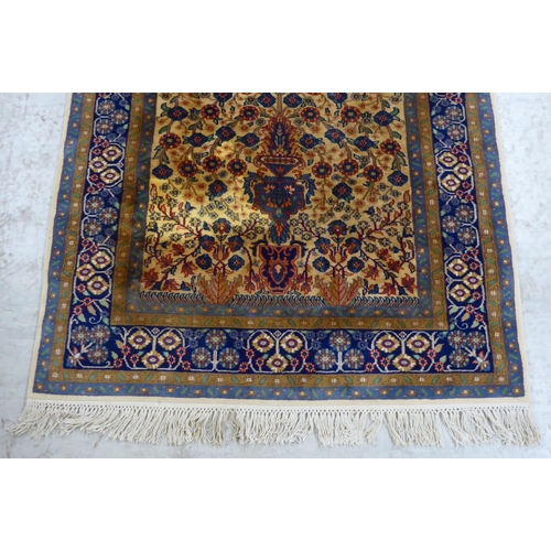 299 - A Prayer rug, decorated with flowerheads, on a multi-coloured ground  48