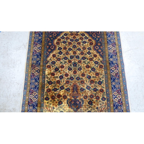 299 - A Prayer rug, decorated with flowerheads, on a multi-coloured ground  48