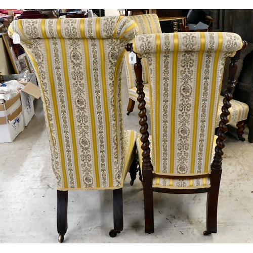 306 - Two similar late Victorian, mahogany framed prie dieu style chairs with later two-tone, floral patte... 