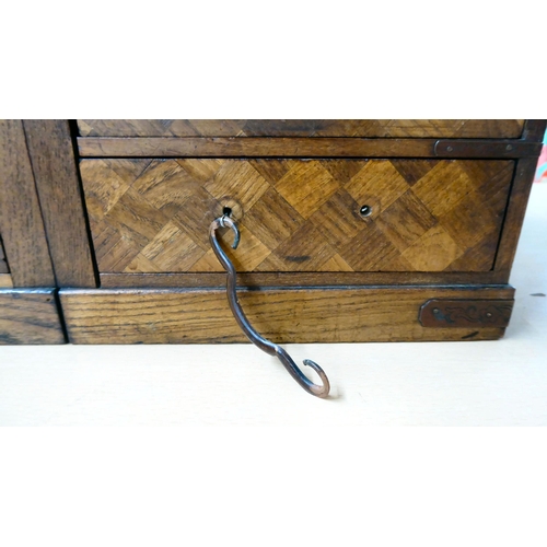 322 - A mid 20thC Japanese parquetry fruitwood veneered table top collector's chest with seven drawers, on... 