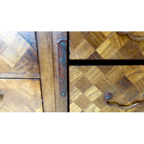 322 - A mid 20thC Japanese parquetry fruitwood veneered table top collector's chest with seven drawers, on... 