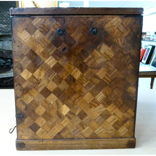 322 - A mid 20thC Japanese parquetry fruitwood veneered table top collector's chest with seven drawers, on... 