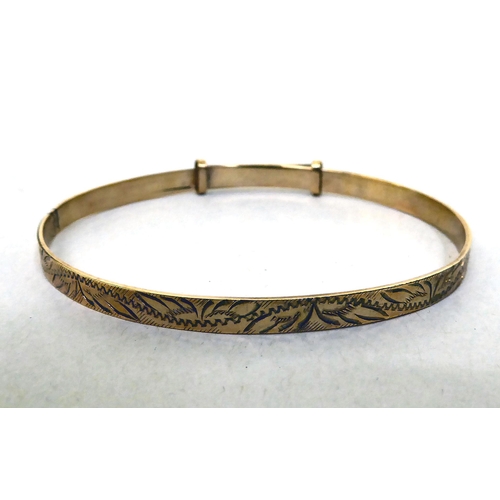 323 - A 9ct gold Christening bangle