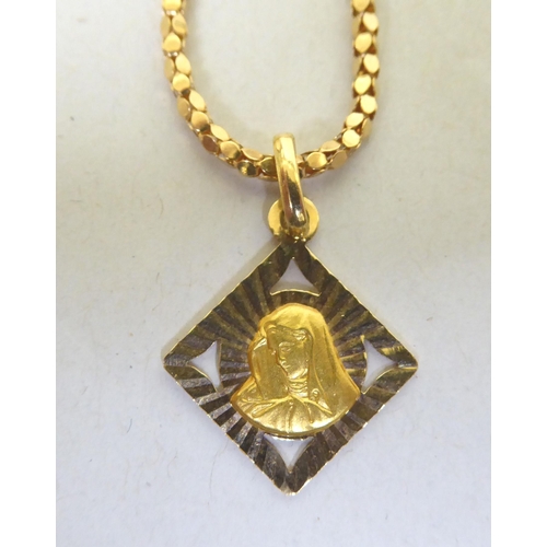 324 - A yellow metal neckchain and pendant  stamped 750