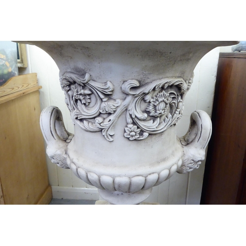 332 - A cream painted composition stone pedestal, twin handled urn, on a separate plinth  43