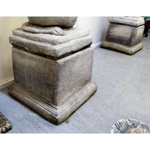 333 - A pair of modern composition stone lion terrace ornaments, sitting upon balls, on a separate plinth ... 