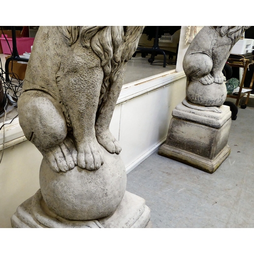 333 - A pair of modern composition stone lion terrace ornaments, sitting upon balls, on a separate plinth ... 