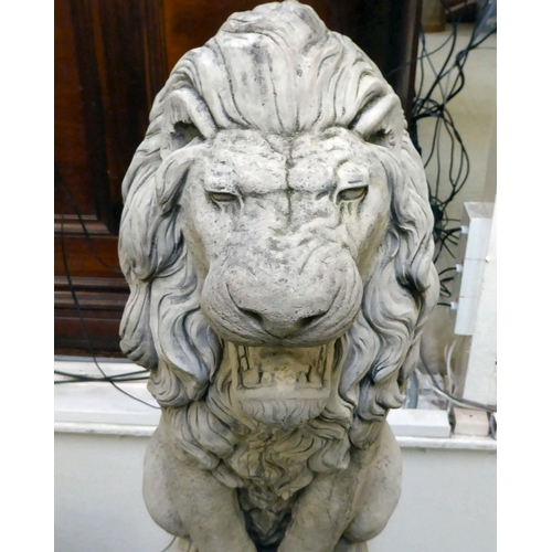 333 - A pair of modern composition stone lion terrace ornaments, sitting upon balls, on a separate plinth ... 