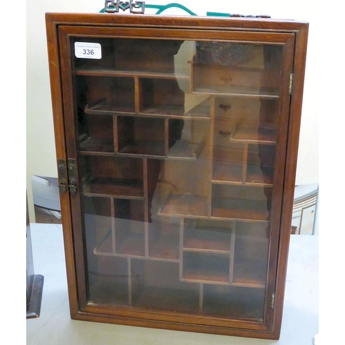 336 - Two dissimilar 20thC display cabinets, viz. a stained pine and glazed, five shelf example, on a plin... 