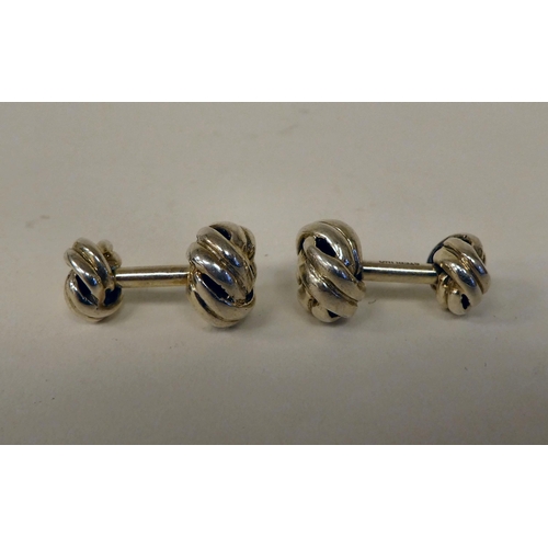 83 - A pair of Sterling silver lovers knot, post style cufflinks