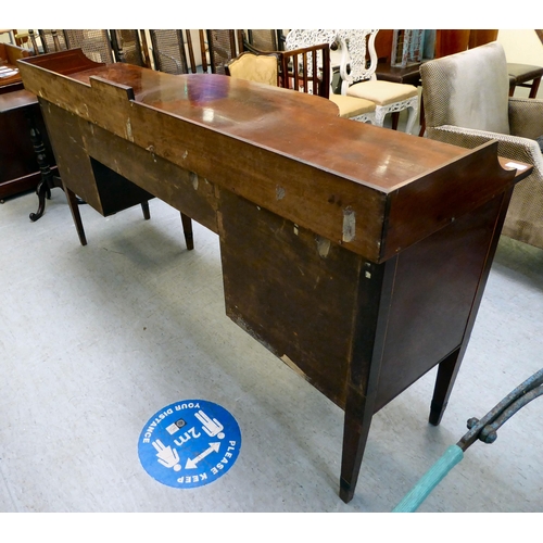 90 - A Regency Irish satinwood inlaid, mahogany breakfront sideboard with three inline drawers, above a c... 