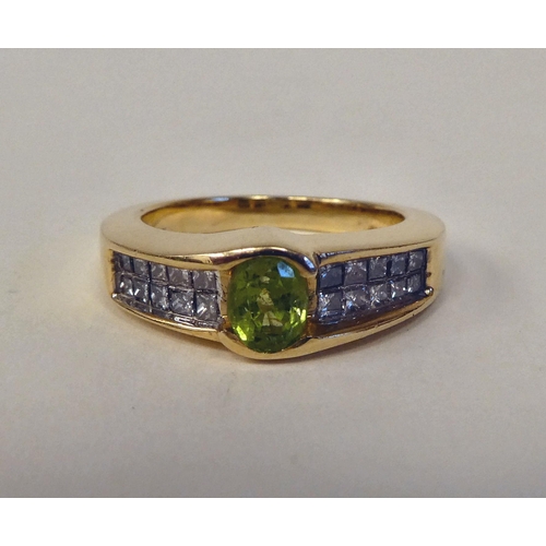 94 - A 14ct gold peridot and diamond set ring