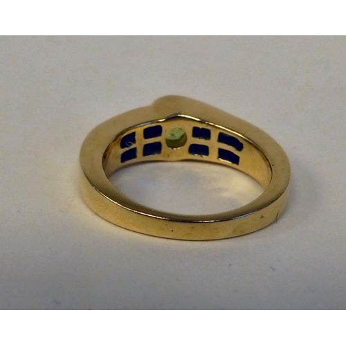 94 - A 14ct gold peridot and diamond set ring