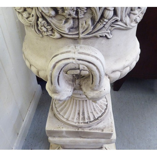 332 - A cream painted composition stone pedestal, twin handled urn, on a separate plinth  43