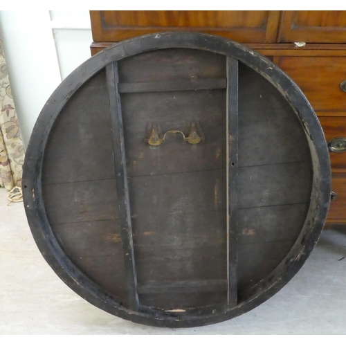 152 - A Victorian oak breakfast table with a decoratively inlaid centre, raised on a triform pillar, an in... 