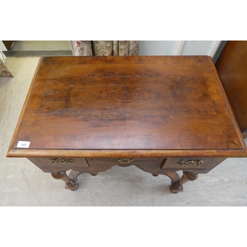 159 - A 17thC style yew wood lowboy, comprising three short drawers, over a fretwork and pendant frieze, r... 