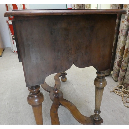 159 - A 17thC style yew wood lowboy, comprising three short drawers, over a fretwork and pendant frieze, r... 