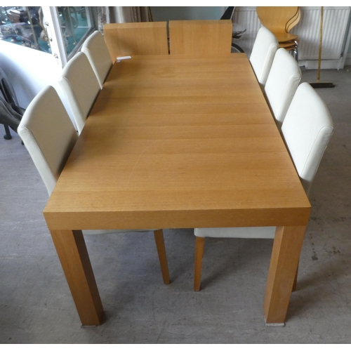 161 - A Habitat light oak dining table, raised on square section legs  30