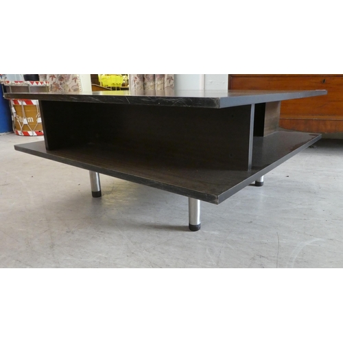 231 - A modern mahogany effect, two tier coffee table, raised on tubular legs  17