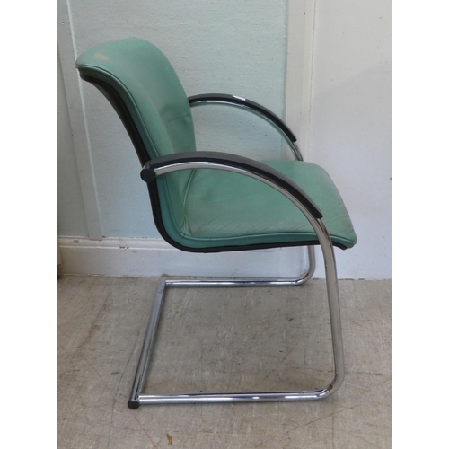 234 - A modern Verco desk chair with a cushioned green hide upholstered seat, on a splayed frame