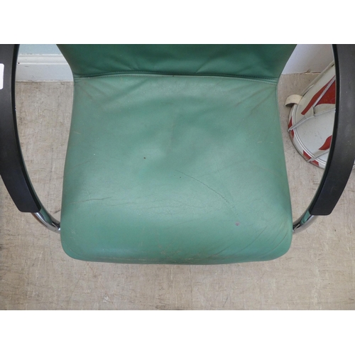 235 - A modern Verco desk chair with a cushioned green hide upholstered seat, on a splayed frame