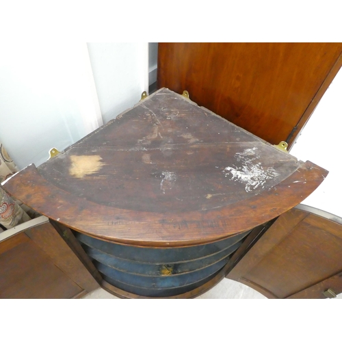 277 - A George III oak quadrant, twin panelled door, hanging corner cabinet, on a plinth  43