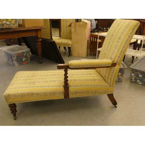 307 - An Edwardian mahogany showwood framed chaise longue with later two-tone, floral patterned fabric uph... 