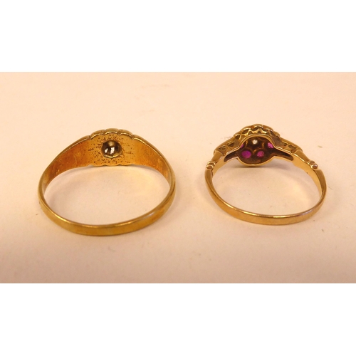 41 - A yellow metal gypsy ring  stamped 18ct; and another floral design ring, set with rubies and diamond... 