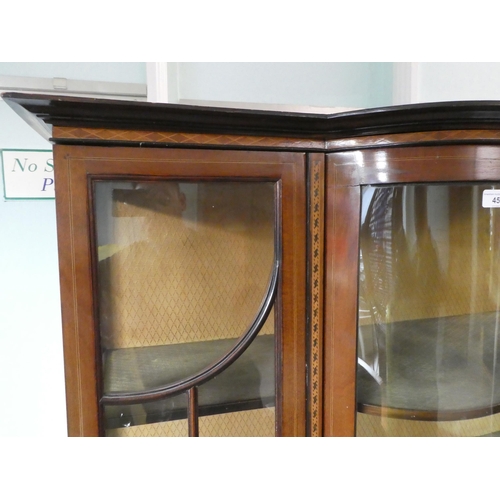 45 - An Edwardian string inlaid marquetry mahogany display cabinet, the central bow front section flanked... 