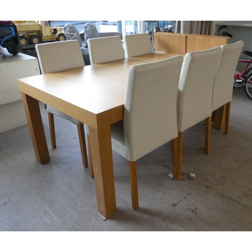 161 - A Habitat light oak dining table, raised on square section legs  30