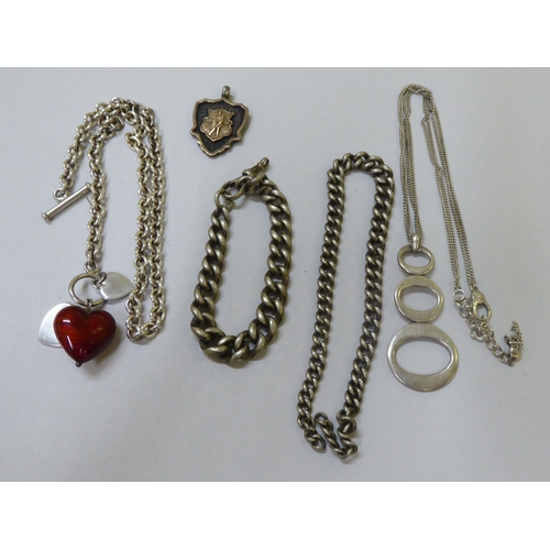 11 - Silver and white metal items of personal ornament: to include watch chains; bangles; and rings ... 