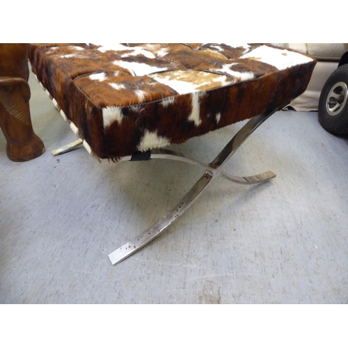 339 - A Barcelona style, chrome finished chair and stool, each with animal skin upholstered cushions