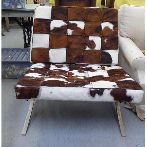 339 - A Barcelona style, chrome finished chair and stool, each with animal skin upholstered cushions