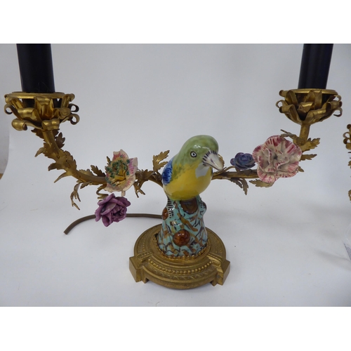 1 - A pair of table lights, each comprising two gilt metal and painted porcelain branches, separated by ... 