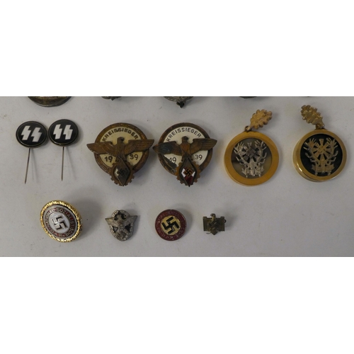 106 - Miscellaneous German military and related badges: to include oval pin brooches; and a 1939 Kreissieg... 