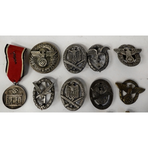 106 - Miscellaneous German military and related badges: to include oval pin brooches; and a 1939 Kreissieg... 