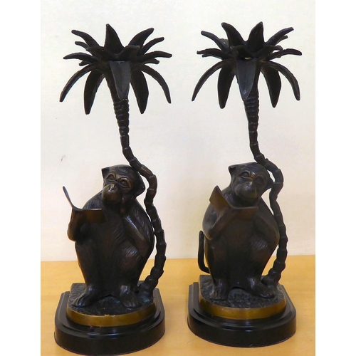 121 - A tribal blackened iron group, depicting three dancing figures, on a stepped base  13