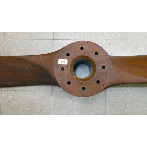 125 - A vintage laminated teak/mahogany aircraft propeller, dating from the 1930s, bears several reference... 