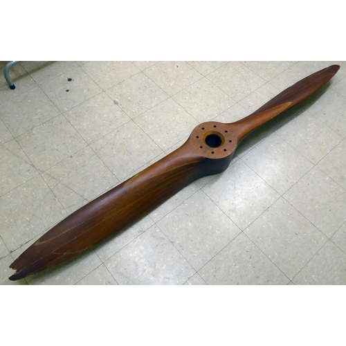 125 - A vintage laminated teak/mahogany aircraft propeller, dating from the 1930s, bears several reference... 