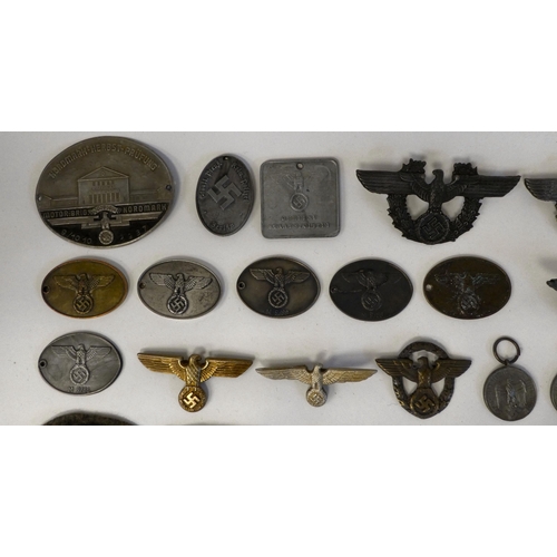 130 - A miscellany of German Nazi era badges: to include a Motorstaffel NSKK; and other embroidered unifor... 