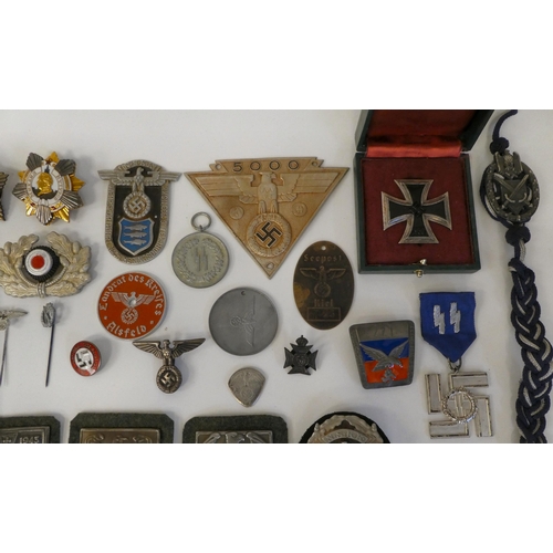 130 - A miscellany of German Nazi era badges: to include a Motorstaffel NSKK; and other embroidered unifor... 