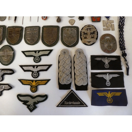 130 - A miscellany of German Nazi era badges: to include a Motorstaffel NSKK; and other embroidered unifor... 