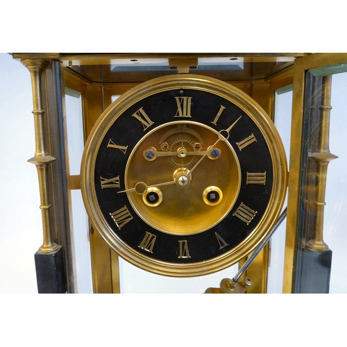 142 - A late Victorian four glass and black slate cased mantel clock with bevelled panels, integral, outse... 