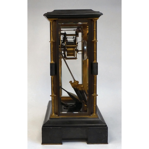 142 - A late Victorian four glass and black slate cased mantel clock with bevelled panels, integral, outse... 